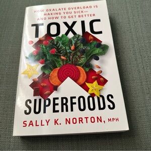 White and Black Bookshelf with Non-Fiction Titles